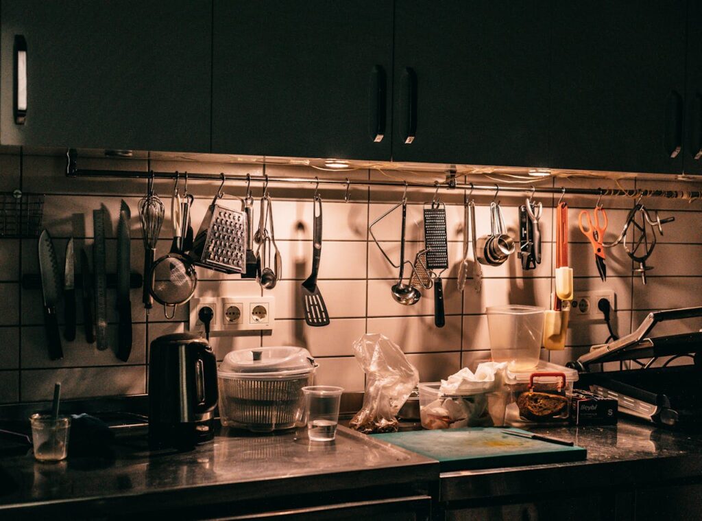 Well-equipped kitchen with hanging utensils