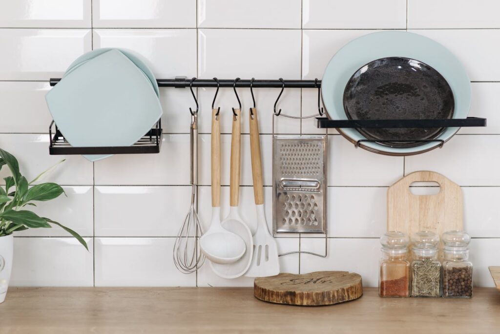 Kitchen utensils and plates organized neatly.